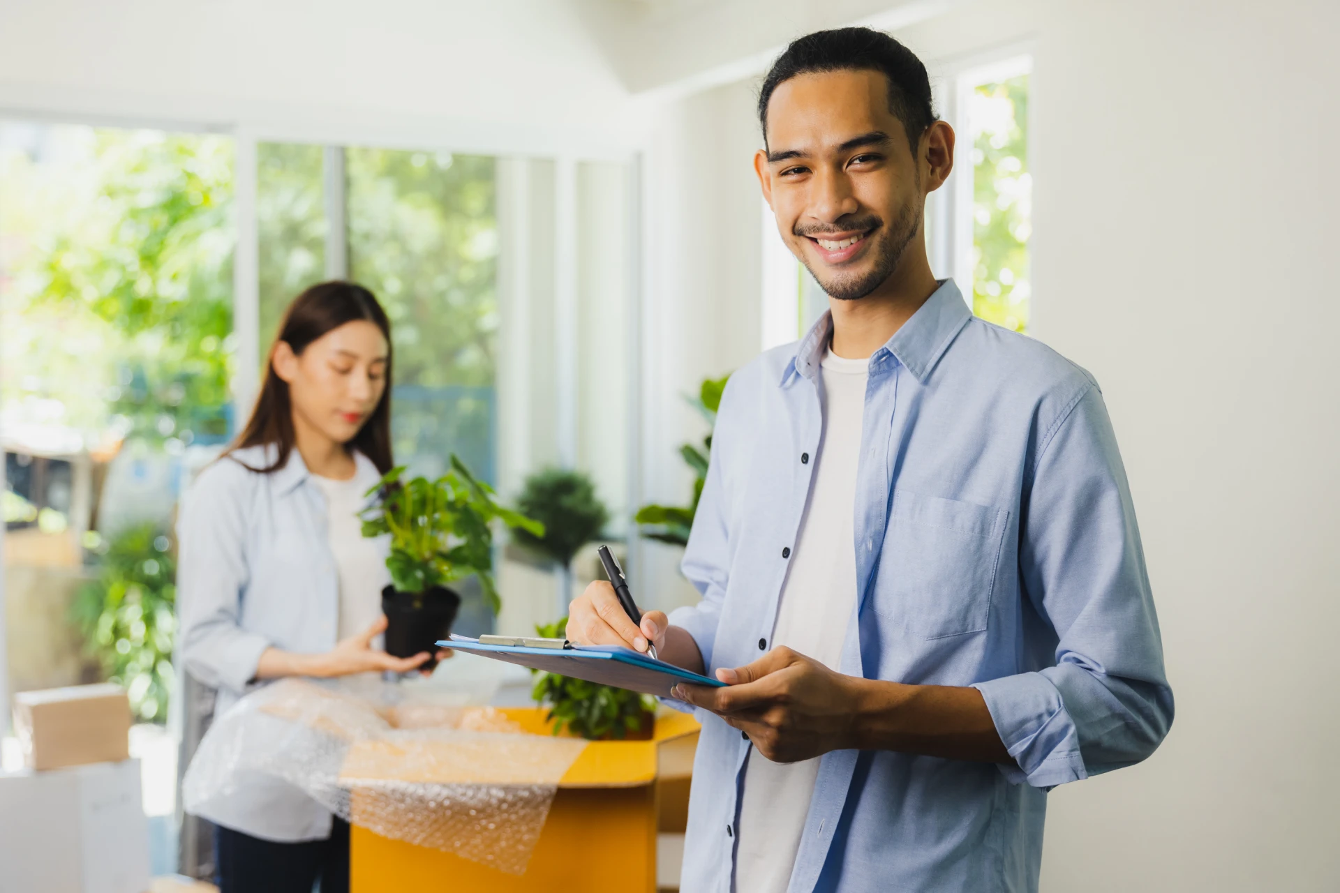 smiling man with woman packing house plants 2026 09 21 14 08 36 utc 1